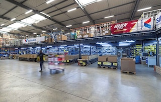 Operators perform batch picking in the warehouse using carts