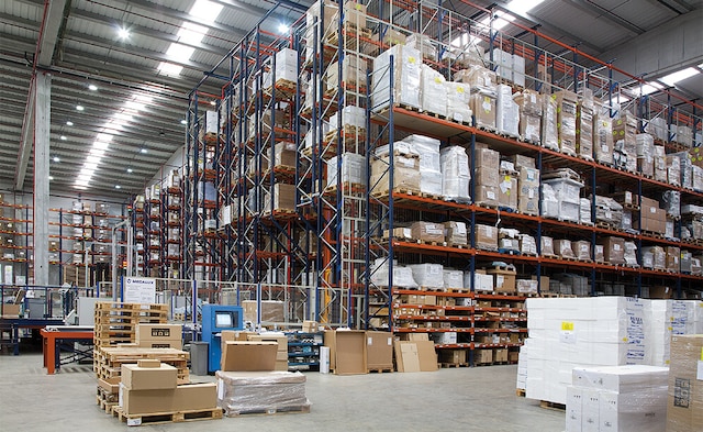 Next to the automated warehouse, six conventional double-depth pallet racks are arranged