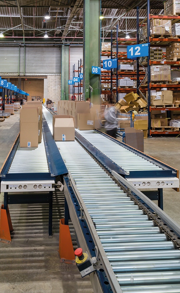 Operators move to the shelves using handcarts to manually collect SKUs indicated to them by the warehouse management software (WMS)