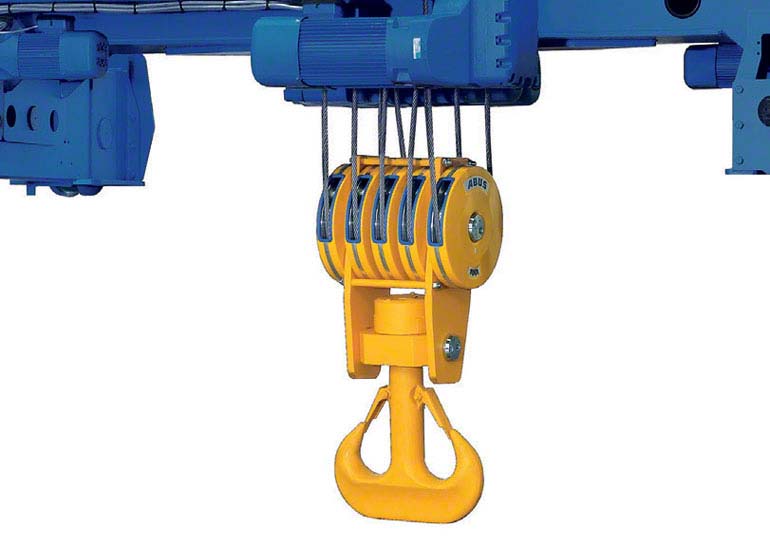 Hoists move sideways along raised beams.