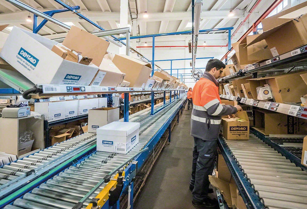 Logistics operator putting together a warehouse order Logistics operator putting together a warehouse order