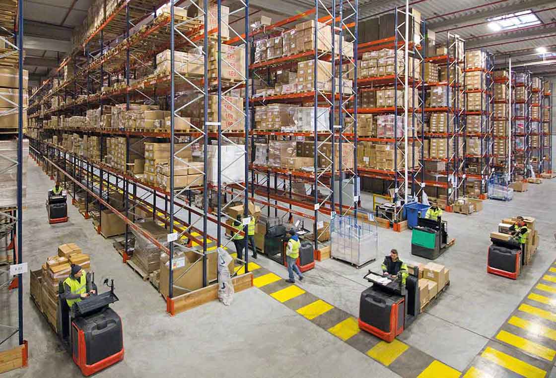 Forklifts moving goods in a warehouse