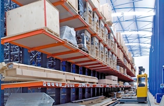 Securing a continuous run of wooden shelving to cantilever arms allows for the storage of palletised loads Securing a continuous run of wooden shelving to cantilever arms allows for the storage of palletised loads