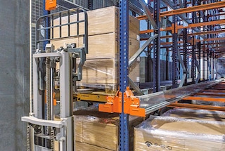 The forklift places the pallet at the entrance to the channel