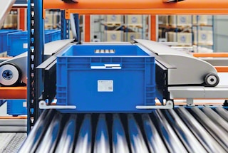 The shuttle retrieves bins from the racking