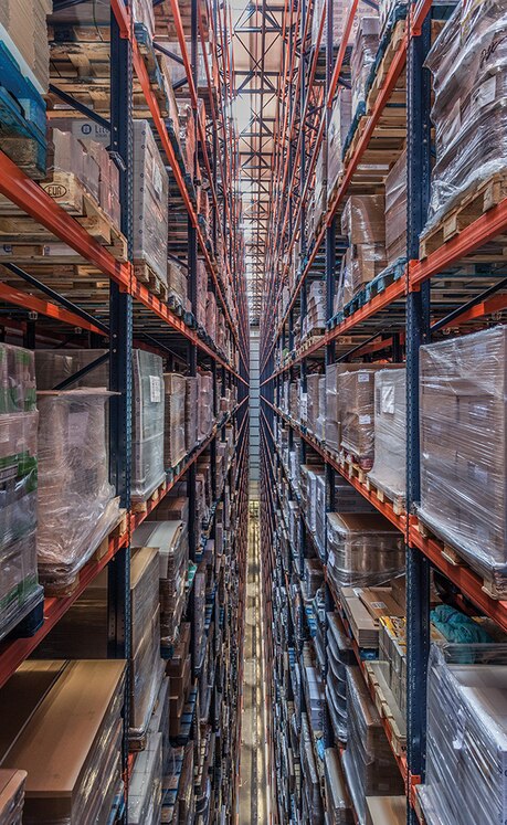 The pallet racks are 21 load levels high, every level houses three pallets deep