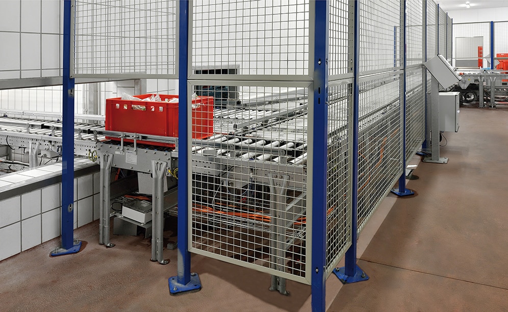 Conveyors are protected by metal mesh enclosures as a hazard prevention measure